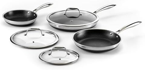 HexClad Hybrid Nonstick Fry Pan Set showcasing 8, 10, and 12-inch pans with glass lids on a modern stovetop.