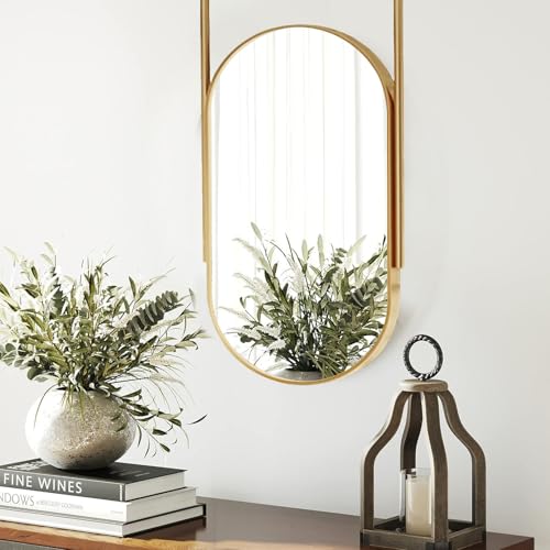 Miroir ovale suspendu en métal pour aménagement de salle de bain contemporaine