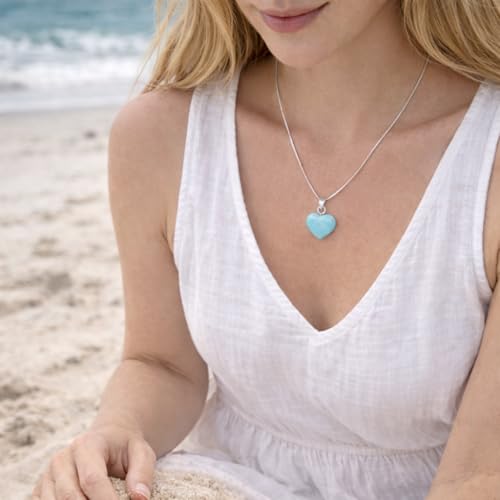 Woman wearing Larimar Heart Pendant at beach