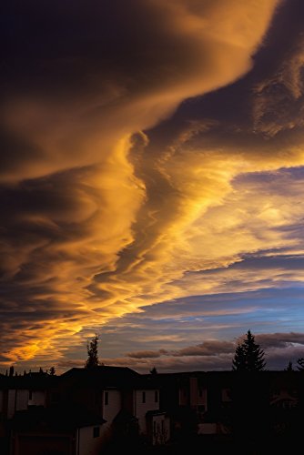 Posterazzi Dramatic colourful clouds at sunset with interesting formations and some blue sky with houses in a neighbourhood Calgary Alberta Canada Poster Print, (24 x 38)