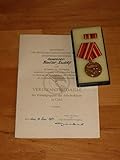 verdienstmedaille ddr  Verdienstmedaille der Kampfgruppen der Arbeiterklasse der DDR in Gold 1984 (Urkunde, Medaille inkl. Interimsspange in Etui)
