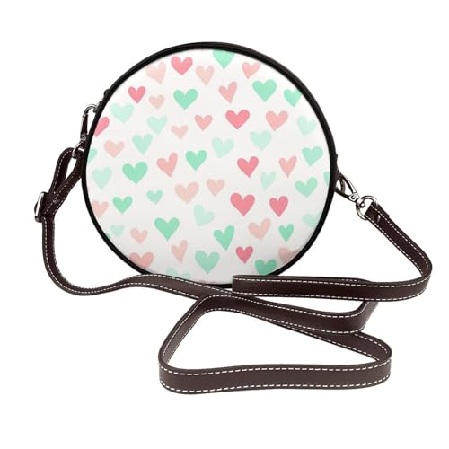 Sac bandoulière rond pour femme en cuir végétalien aux finitions artisanales