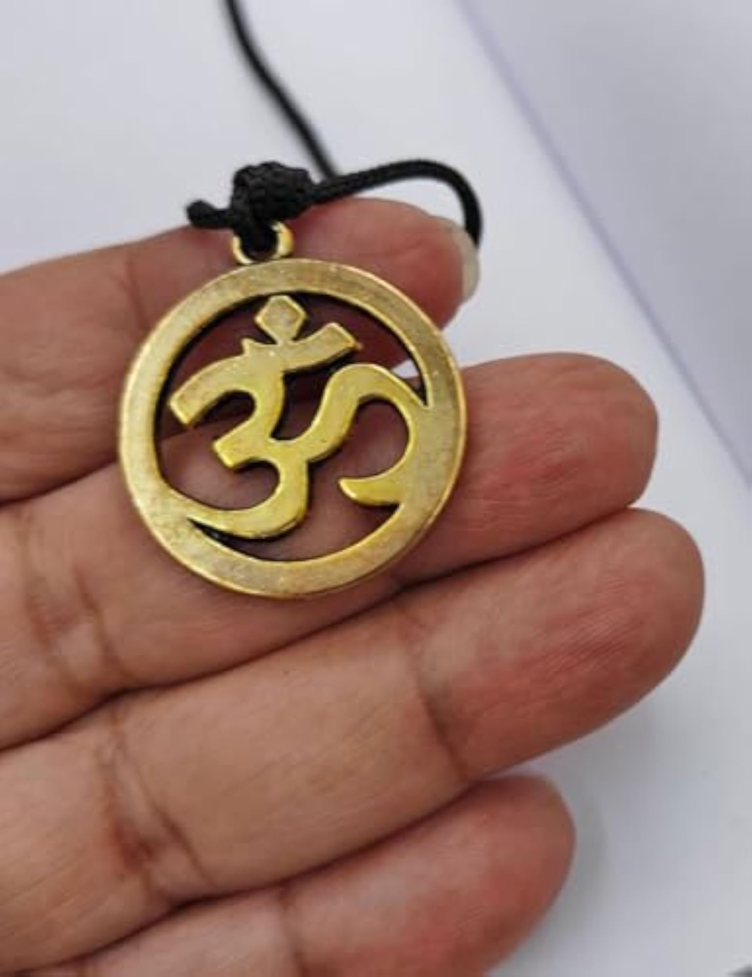 Unisex Adjustable Golden Om Locket Pendant on Black Thread