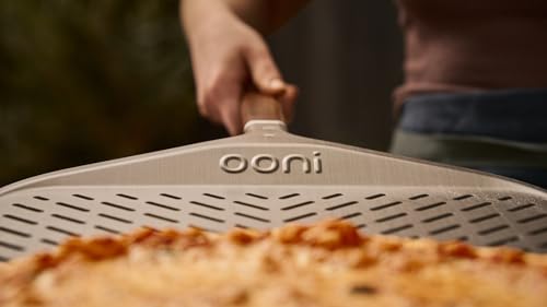 Image of ooni 14 inch Signature Perforated Pizza Peel - Anodised Aluminum Metal Pizza Peel 14 Inch With Long Walnut Wood Handle, Pizza Spatula Paddle, Pizza Oven Accessories, Pizza Tools