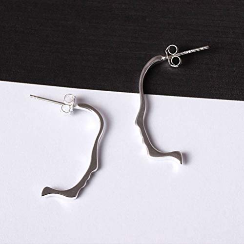 Boucles d'oreilles femmes design visage abstrait et mode créative