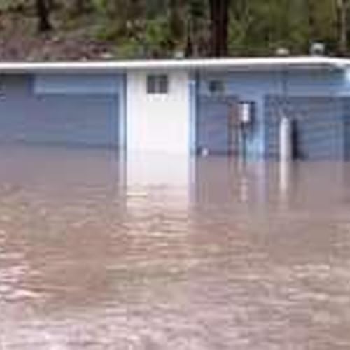 Homes, businesses and roads all impacted by wettest start to July in decades