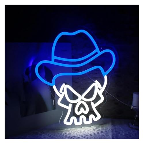 Néon tête de mort cowboy illuminez un mur sombre de chambre à coucher