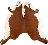 Einzigartige Naturschönheit Jeder unserer Kuhfellteppiche ist ein Unikat und trägt die einzigartige Zeichnung des Hereford-Rinds. Die Kombination von warmem Braun und strahlendem Weiß schafft ein faszinierendes Muster, das sofort ins Auge fällt. Das Fell wurde sorgfältig ausgewählt und handverarbeitet, um höchste Qualität und Haltbarkeit zu gewährleisten.