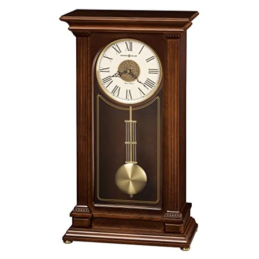 Howard Miller Stafford Mantel Clock 635-169 – Cherry Bordeaux Finish, Inverted V-Matched Teak Wood Veneer, Fluted Columns, Quartz, Triple-Chime Movement