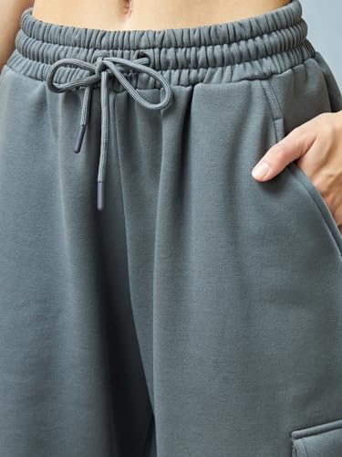 Image of Bewakoof Women's Fleece Super Loose Fit Joggers|Bewakoof Heavy Duty 1.0 | Track pants for woman | Lower for women | Multipurpose | Activewear | Utility Pockets | Lightweight & Flexible Elastic Waist | Casual Joggers | Loose Fit