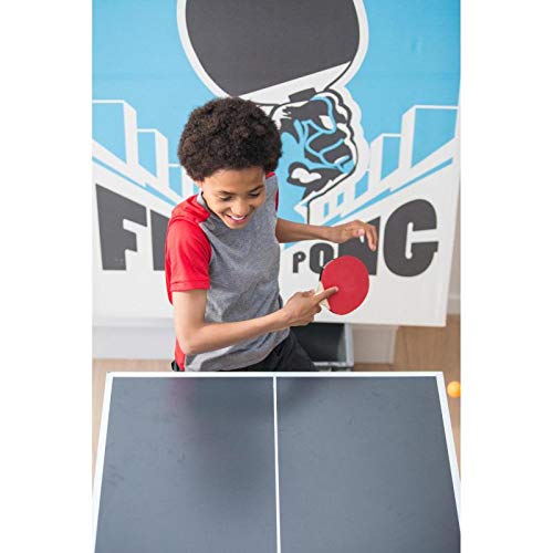 A young person playing table tennis, holding a red Pongori TTR 100 table tennis bat, focused on hitting the ball.