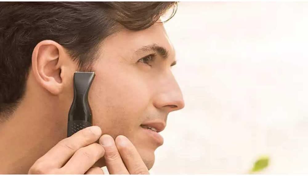 Man using Philips NT5650/16 to trim eyebrow hair