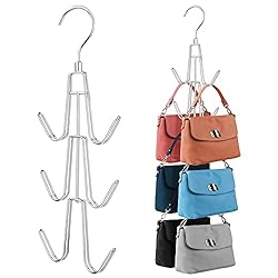 2 silver hanging hooks, 1 holding six purses.