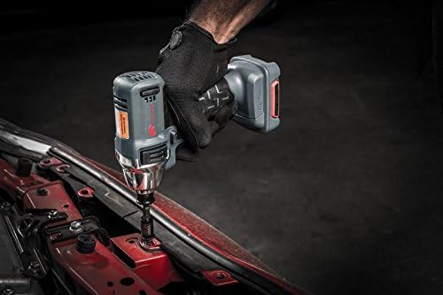 User operating Ingersoll Rand W1130 3/8 inch 12V Cordless Impact Wrench on a vehicle engine bay