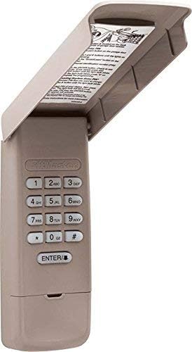 LiftMaster 877MAX Wireless Keypad with cover open, showing numeric buttons and 'ENTER' button.