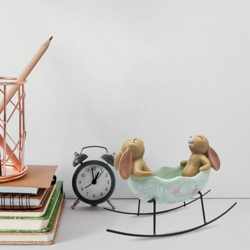 Lapins à bascule dans un œuf de Pâques pour centre de table champêtre