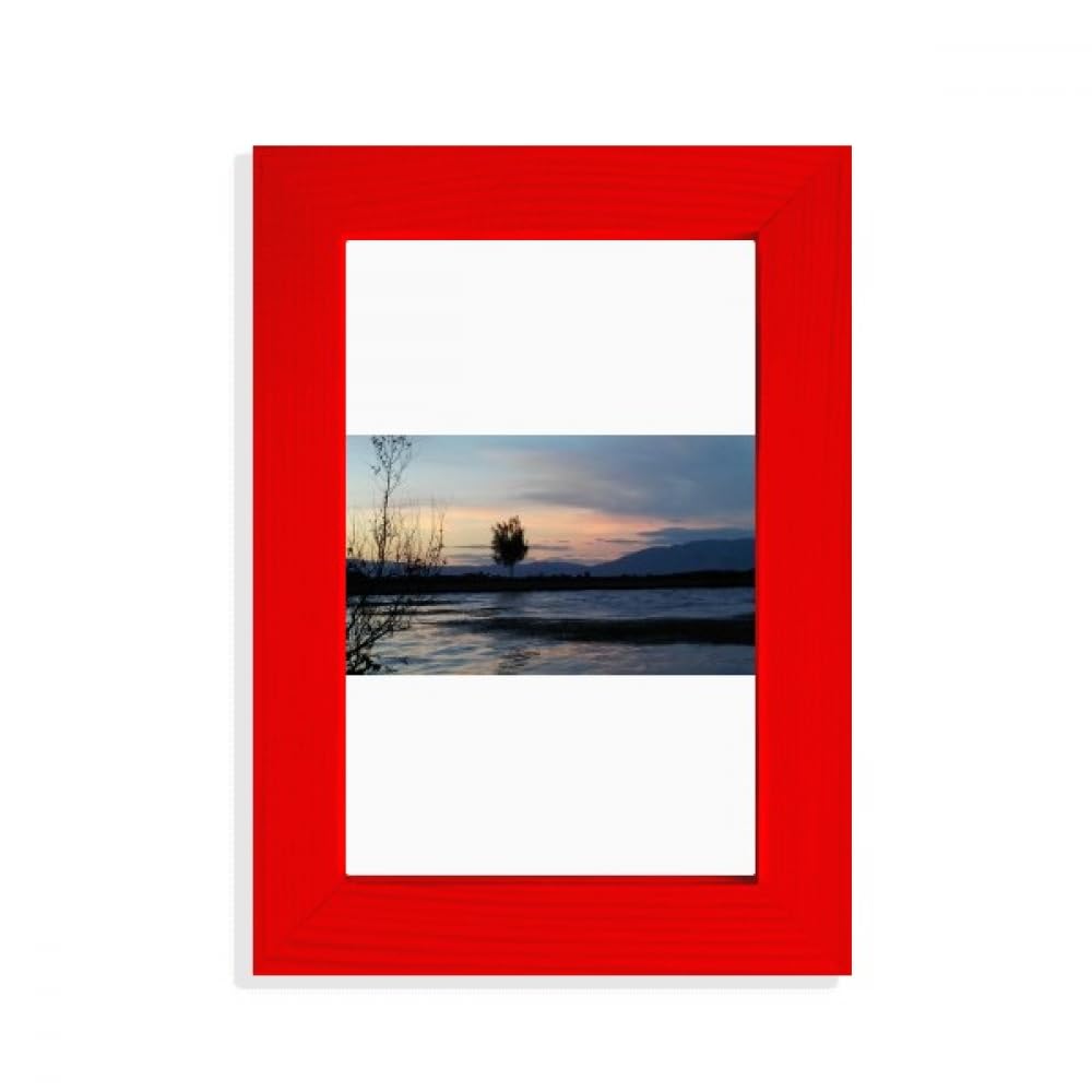 Photographie de plage coucher de soleil capturant l'émotion du soir sous cadre rouge