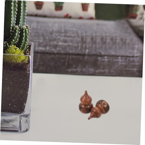 Sachet de madera con escultura calabaza 2 pcs miniatura 6
