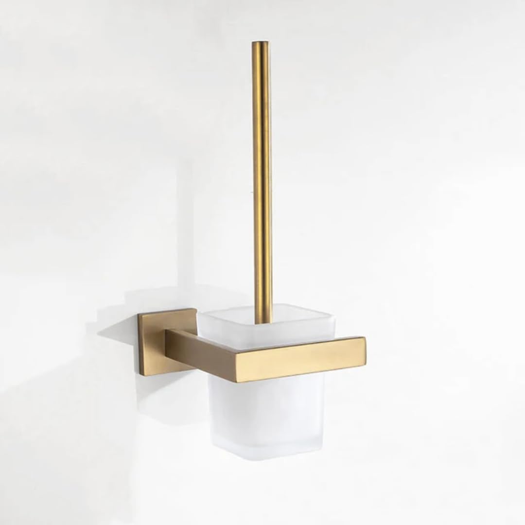 Ensemble quincaillerie or brossé pour une salle de bain chic avec brosse et porte-serviette