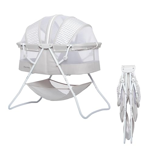 Image of Dream On Me Karley Bassinet in Grey, Lightweight Portable Baby Bassinet, Quick Fold and Easy to Carry , Adjustable Double Canopy, Indoor and Outdoor Bassinet with Large Storage Basket.