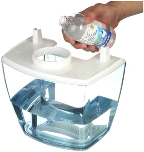 Hand pouring water into the humidifier tank