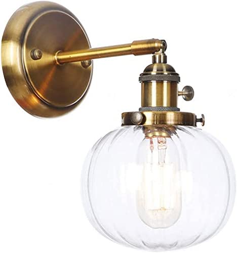 Aplique de pared ajustable E27 con acabados de metal y cristal para un dormitorio elegante