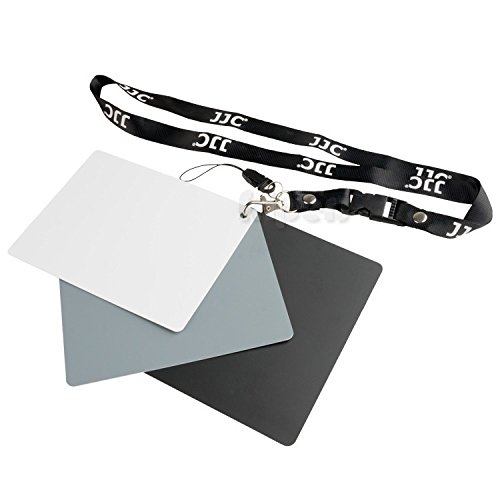 Close-up of the JJC GC-3 grey card attached to a black lanyard with a metal clip and plastic buckle.