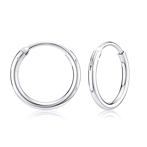 Boucles d'oreilles créoles argentées grands anneaux idéales pour sublimer vos soirées et looks urbains