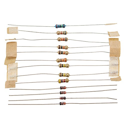 Assortment of resistors and diodes, organized for assembly.