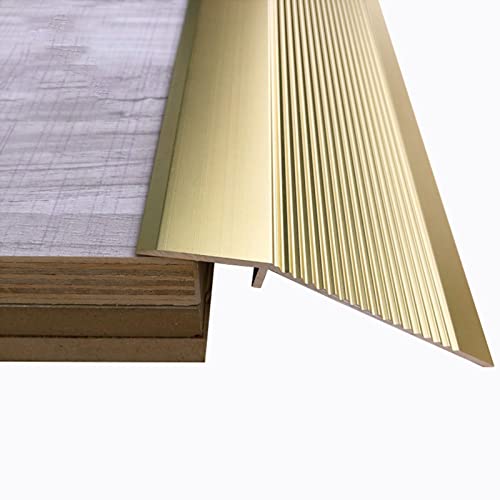 Barre de transition dorée en aluminium pour harmoniser carrelage et linoléum