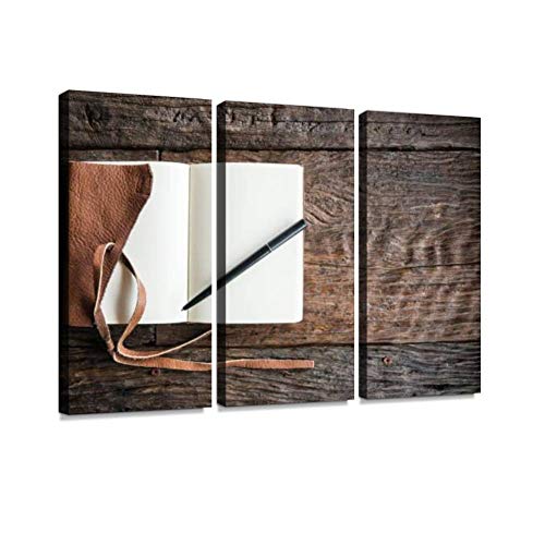 the leather book with pen on the wood table vintage