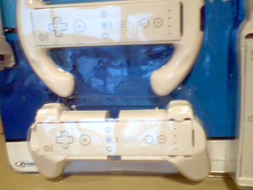 Zenex on the Move Wii Gaming Accessories 7-in-1 Sports Pack Blister Package Version Model#301-9713 for Nintendo Wii System---comes with Wii Tennis Racquet, Wii Golf Club, Wii Baseball Bat, Wii Pistol, Wii Steering Wheel, Wii Remote Grip, & Wii Remote Handle---user Friendly Snap-in Design Comfortable Converts Wii Controller Into 6 Different Gaming Kits---each of the Sets Are for Use with Compatible Wii Console Game. The Accessories Set Help Simulate the Corresponding Game Actions. (Nintendo Wii System Console Version)