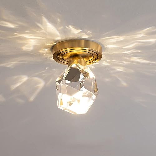 Lampara de techo dorada de cristal para crear ambientes en salon y comedor