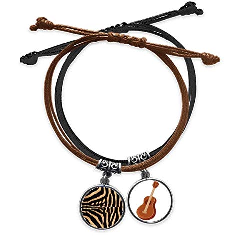 Pulsera de cuero detallada con colgante de guitarra y pluma abstracta