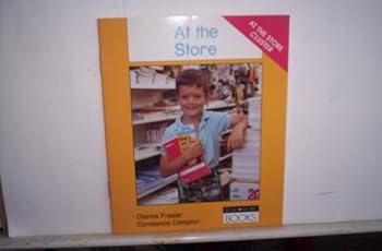 Paperback AT THE STORE (DOMINIE READMORE BOOKS) Book