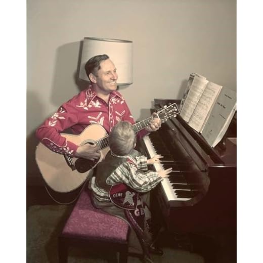 Gene Autry plays guitar sitting with young son at piano 24x36 inch Poster