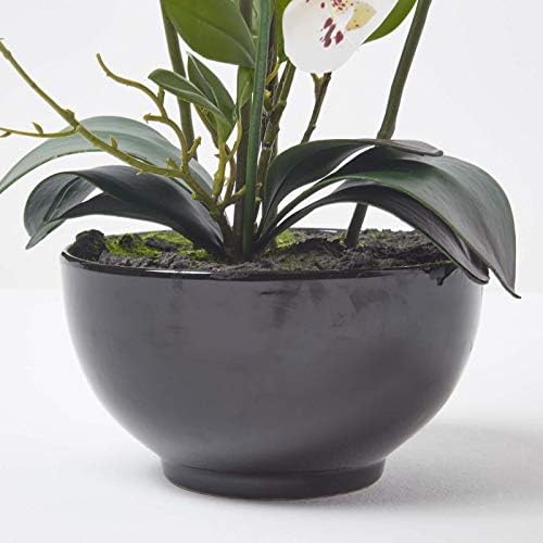 HOMESCAPES Artificial White Orchid in Pot 62 cm Tall Lifelike Faux Orchid Plant In Black Ceramic Bowl with Real Touch Silk Flowers and Green Leaves Phalaenopsis Orchid Flower for Indoor Decoration