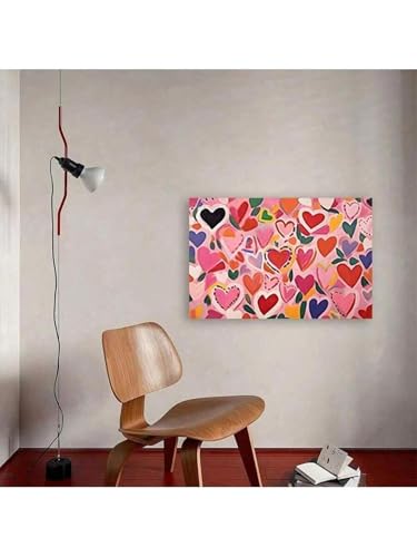 Peinture murale rose pour raviver un mur terne grâce à une toile cœur d'amour colorée
