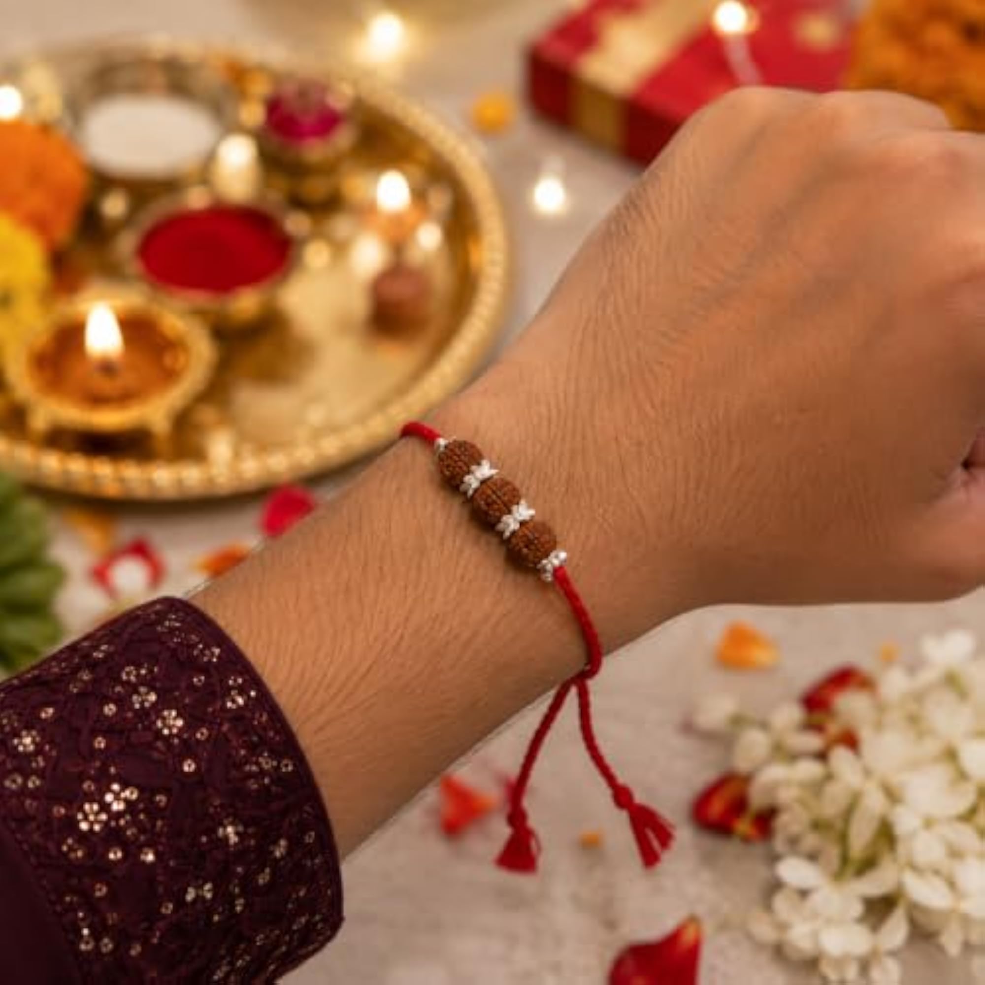 Traditional Red Mauli Thread Silver Rakhi with Premium Rudraksha Beads
