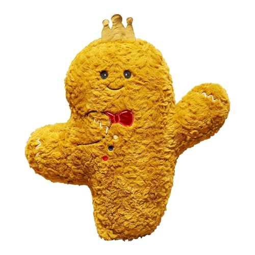 Coussins mignons en peluche de pain d'épice au pied du sapin de Noël