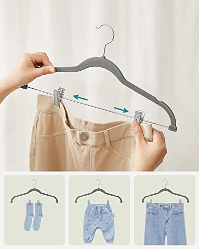 Image of SONGMICS Velvet Hangers with Clips, 12 Pack, 42.5 x 23.5 x 0.6 cm | Space Saving Hangers for Skirts and Trousers, Non-Slip, Adjustable Clips, Grey, BREANNA Collection CRF12V