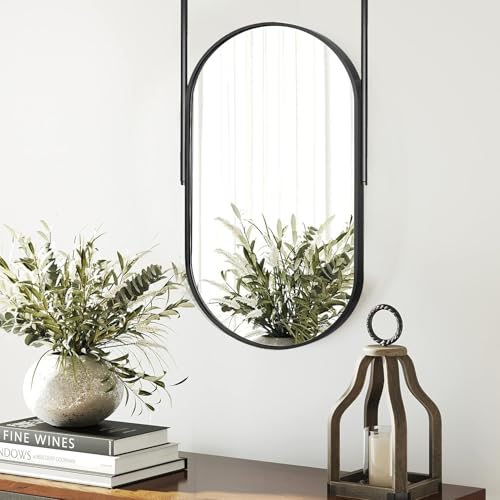 Miroir ovale noir suspendu au plafond pour salle de bain moderne