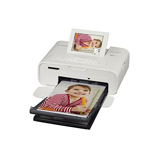 Canon Selphy CP1300 Fotodrucker 10x15 cm (mobiler Drucker, WLAN, USB, 300 300 dpi, optionaler Akku, Farbdisplay, Speicherkartenslot, Apple AirPrint, Passfotodruck, Postkartendruck), weiß