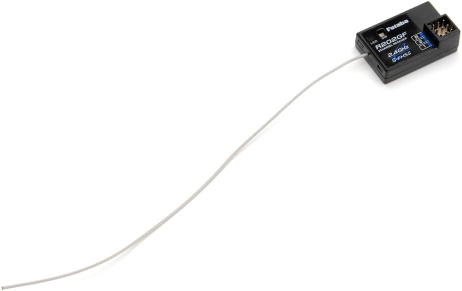 Futaba R202GF receiver with its long antenna wire extended.