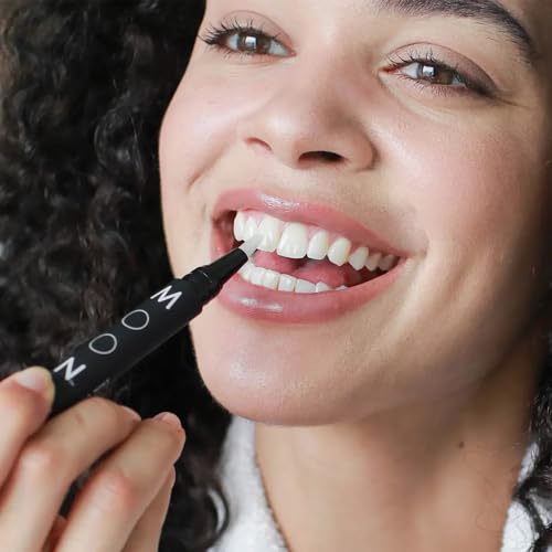 Image of MOON On-The-Go Teeth Whitening Kit, 14 Peppermint Dissolving Strips + 0.09 Fl Oz Vanilla Mint Pen, Remove Stains & Whiten Teeth up to 7 Shades in 2 Weeks, Travel Essentials, Vegan