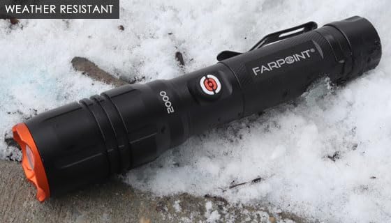 Farpoint Platinum Series flashlight lying on snow, demonstrating its weather-resistant design.
