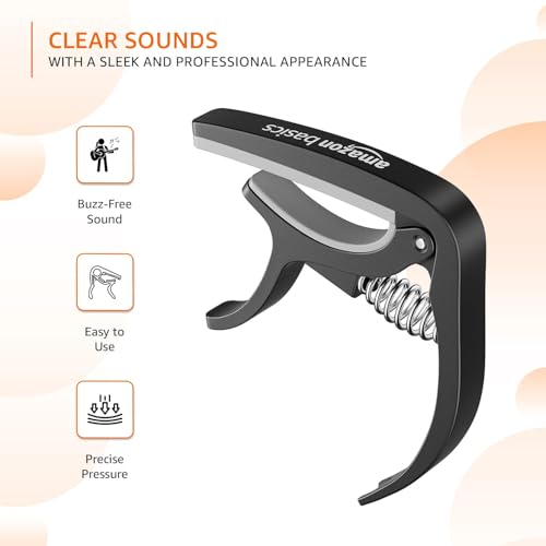 Image of Amazon Basics Guitar Capo with Pin Remover | Heavy Duty ABS Material | Versatile Fit | For Acoustic & Electric Guitar, Ukulele and Banjo | Buzz Free (Black)