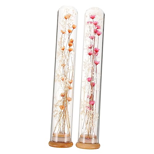Ramo de flores eternas en botella de vidrio