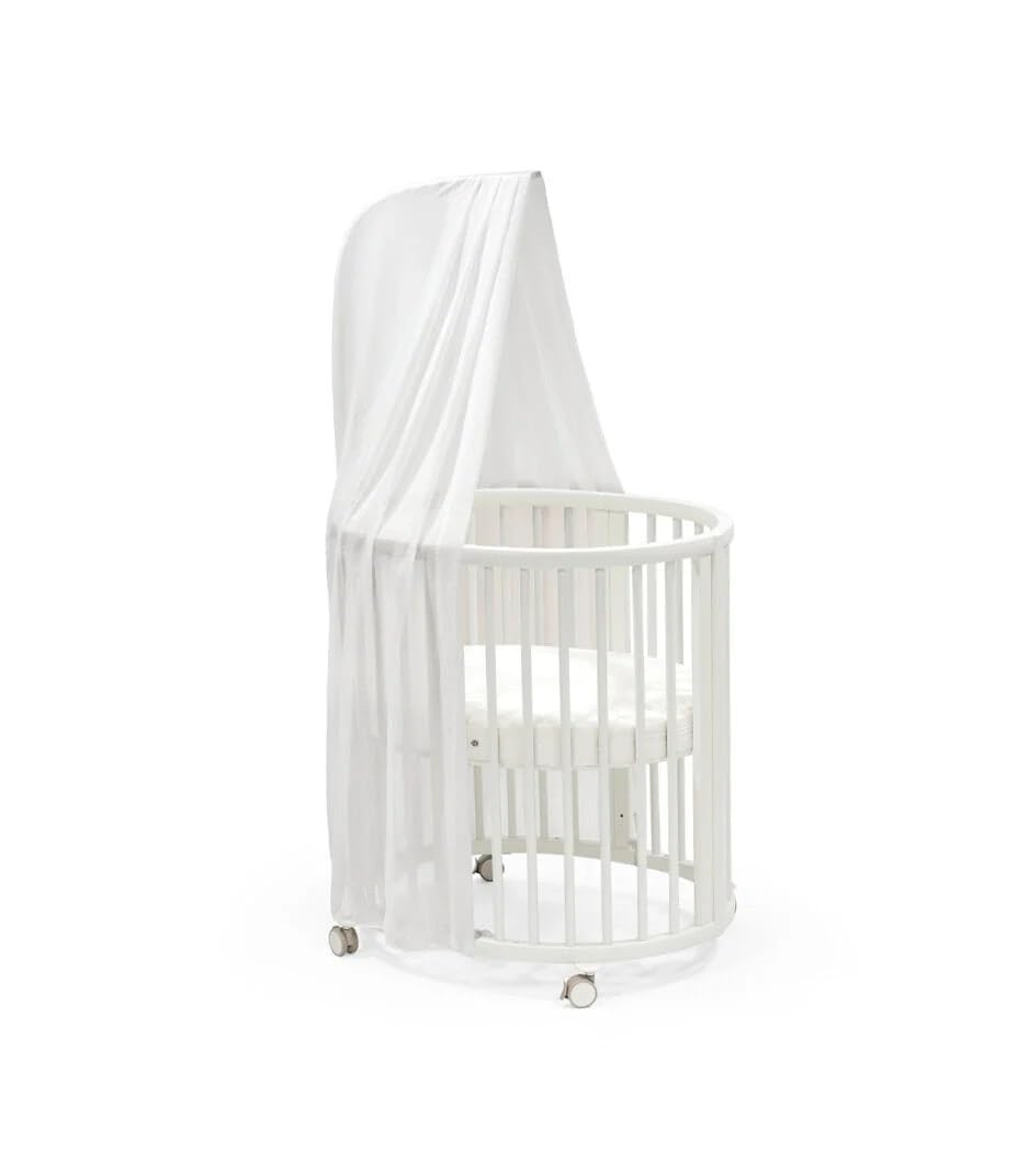 Stokke Sleepi Mini, Bianco - Culla ovale adatta per 0-6 mesi - Base regolabile in altezza, ruote girevoli bloccabili, base materasso traforata per la circolazione dell'aria