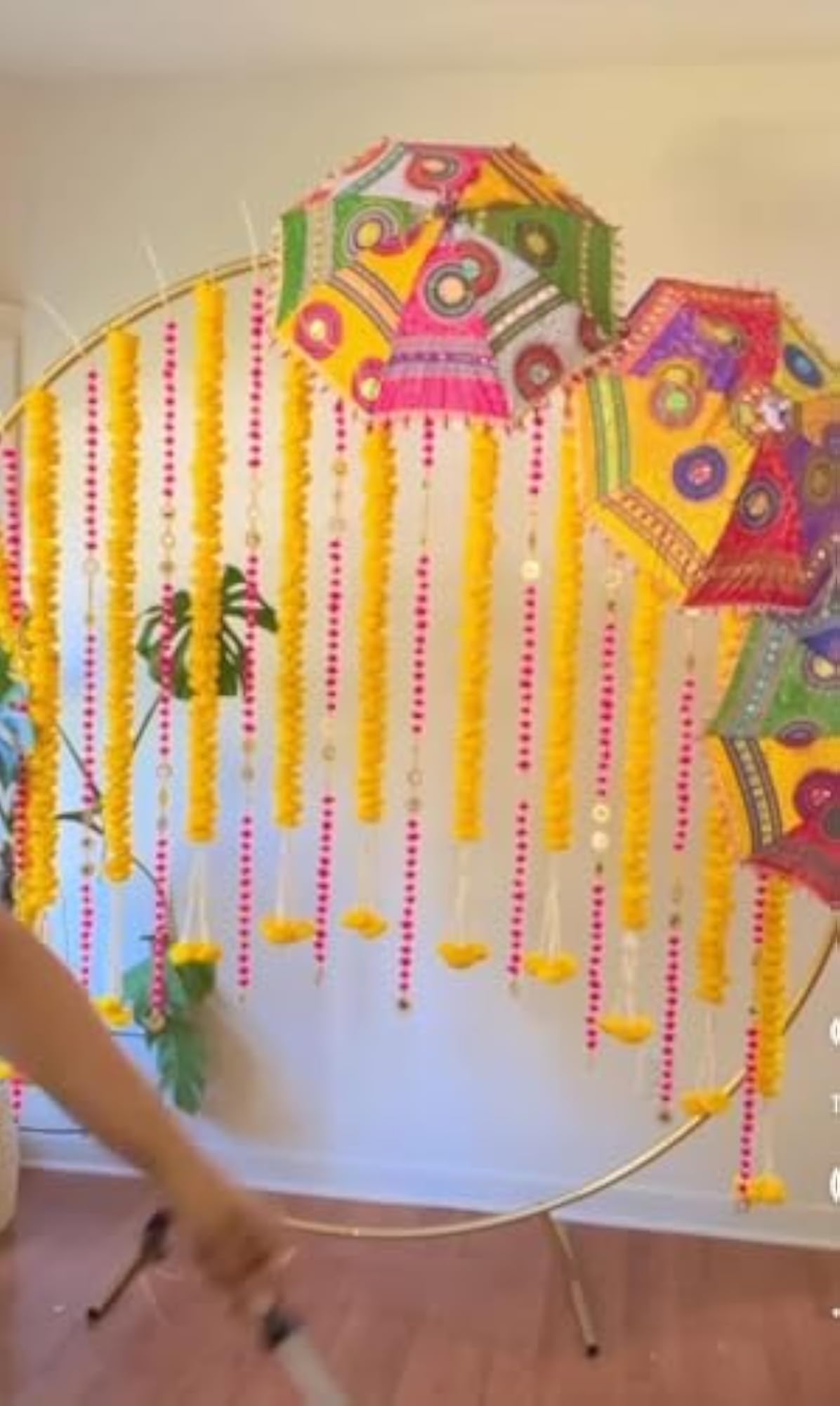 Decorative Ganpati Poojan Setup with Marigold Toran and Umbrellas